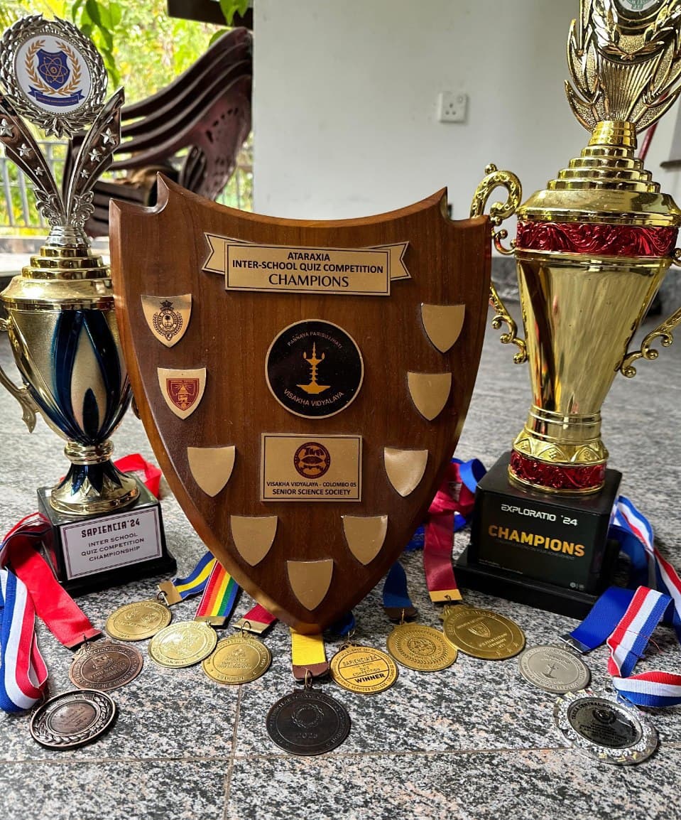 Science quiz trophies and medals won by Hirun De Silva